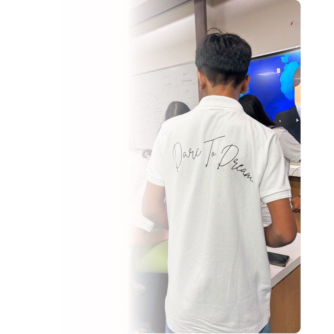 Student wearing Dare to Dream polo shirt at the program